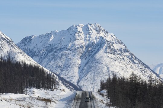 Minivan driving on the Road of Bones, Suntar-Khayata Range, Sakha Republic, Yakutia, Russia