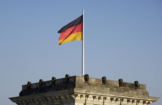 Tower of Building Reichstag with german flag, Berlin, Germany