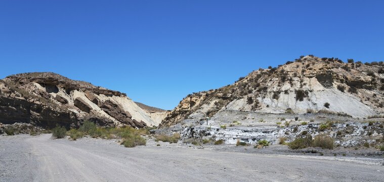 A barren desert landscape with rocky hills and a clear blue sky, La Tortuga, Tabernas Desert, Desierto de Tabernas, location of numerous films and westerns, Tabernas, Almeria, Andalusia, Spain