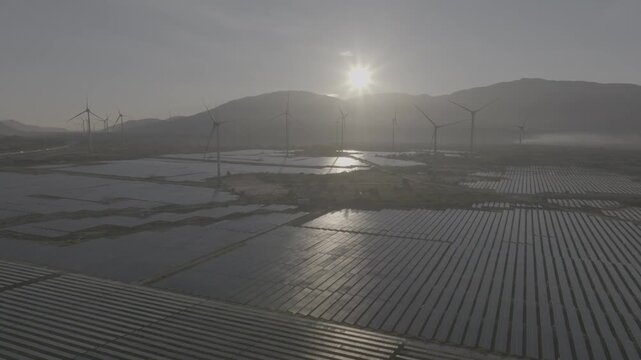 Aerial view of wind turbines and solar farms near the Cam Lam&ndash;Vinh Hao Expressway in Thuan Bac Commune, Khanh Hoa, Vietnam, showcasing large-scale renewable energy infrastructure.