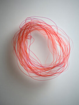 red scribble sketch created with overlapping loops and natural hand movement, isolated on white background. Realistic ink density and soft shadow with ample copy space. red, marker, scribble, 