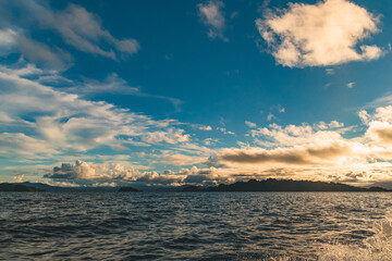 Obraz premium Sunset Seascape with Distant Island in Southeast Sulawesi Indonesia