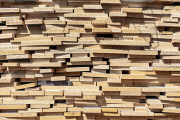 Fototapeta premium A stack of particle board panels at a lumberyard.
