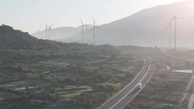 Aerial view of wind turbines and solar farms near the Cam Lam&ndash;Vinh Hao Expressway in Thuan Bac Commune, Khanh Hoa, Vietnam, showcasing large-scale renewable energy infrastructure.