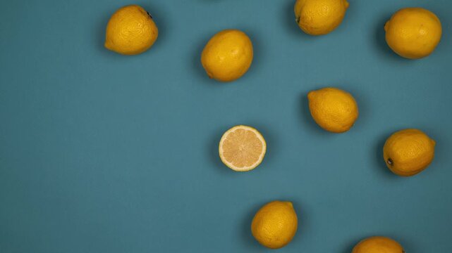 lemon, blue screen, yellow citrus, single fruit, sour taste, bright color, green leaf attached, bumpy rind, oval shape, fresh, chroma key, studio shot, shadow, vibrant yellow, backdrop, texture, edge,