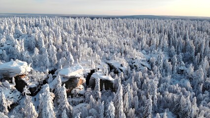 Frozen Mountain Ledges Panorama. Frozen Landscape Showcasing Snowcovered Rocks And Frosted Trees. Media © mediawhalelicensing 