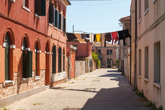 Colorful street with laundry in Murano