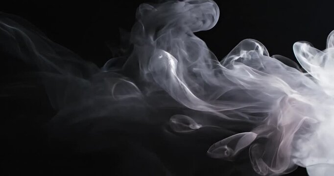 Smoke Clouds on Black Background.