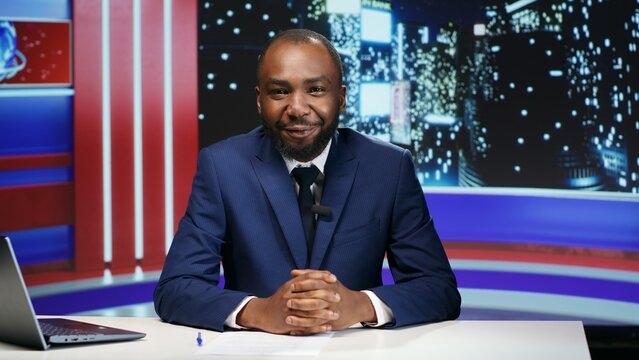 Television host starting late night show to present global news and new events, live broadcast studio. Male journalist discussing about international issues, tv newscast program.