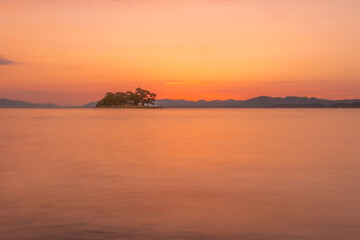 Fototapeta premium Sunset over Yomegashima Island on Lake Shinji, Japan