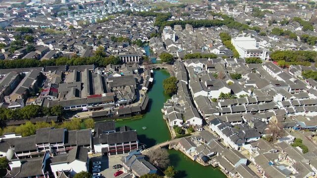 Aerial view of small bridges connecting banks in Jiangsu ancient town China