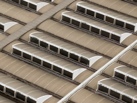 Aerial view of the industrial rooftops and curved skylights of the Centrale Termoelettrica Santa Barbara Enel Santa Barbara, Toscana, Italy.
