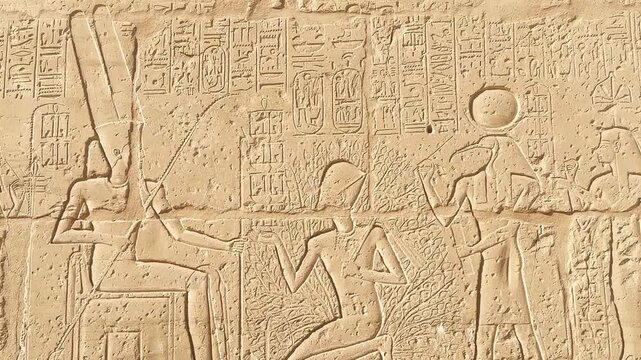 Beautiful bas-reliefs and ancient hieroglyphs from the mortuary temple of Ramesses III at Medinet Habu, Luxor, Egypt