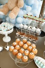 Obraz premium Candy bar for a baby shower or boy’s birthday party decorated in blue and white colors.