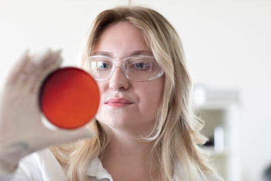 Scientist female with blonde hair working in a labor