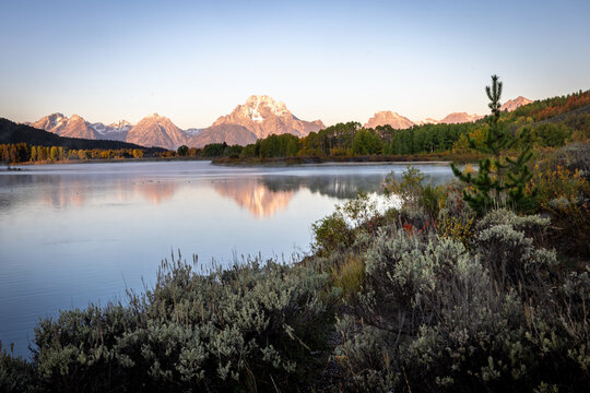 Mountain Lake Reflection at Sunrise With Autumn Trees and Mornin