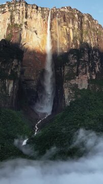 Breathtaking aerial view of Angel Falls cascading down tepui mountain in Venezuela rainforest.