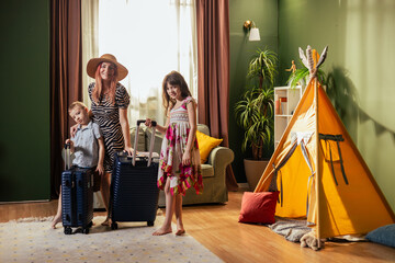 Family with suitcases ready for summer vacation travel © MexChriss