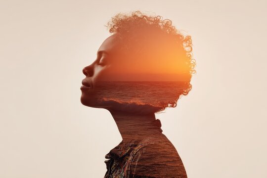 Hopeful mindscape inside a female silhouette showing sunrise, waves, and empowerment energy