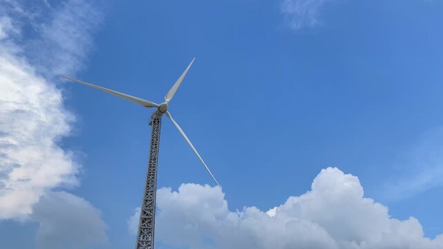 Wind Turbine Generating Renewable Energy Against Blue Sky in Bangladesh
