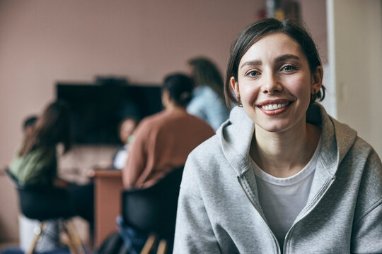 Portrait of smiling female entrepreneur in smart casuals at new company