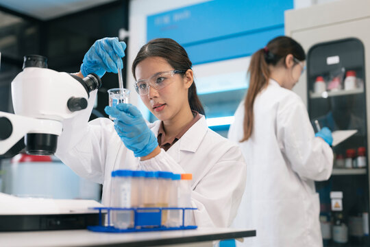 Scientist researching plant extracts for antiviral and virus prevention.