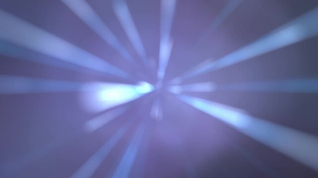 Abstract blue and purple light rays fast zoom background. Glowing cyan bokeh streaks burst, cinematic warp tunnel, sci-fi starburst or futuristic hyper speed space travel motion graphic