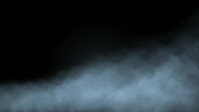 Realistic cloud, smoke or fog blowing slowly on black background. Mystic atmospheric spooky mist ground overlay loop for thriller, horror cinematic design or presentation