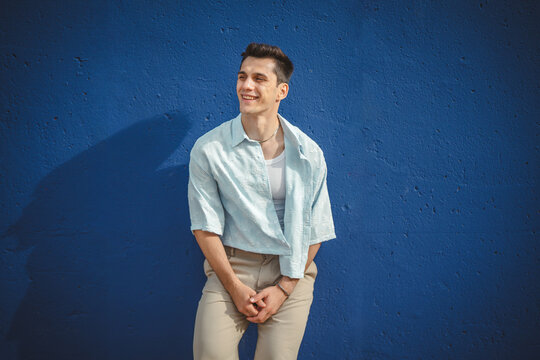 Young confident man posing in modern casual summer fashion