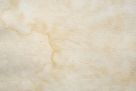 Old vintage paper texture background with aged stains and antique yellowed parchment effect