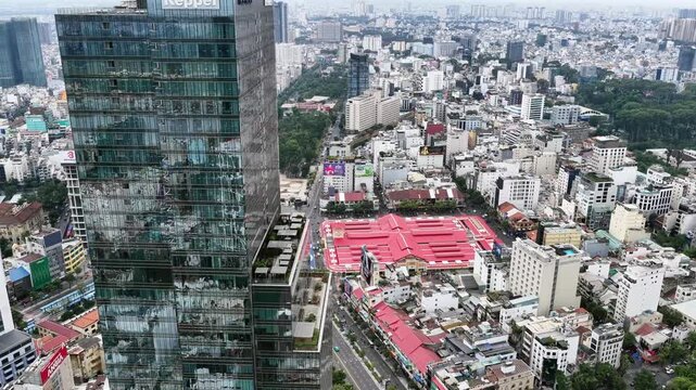view aerial of Ben Thanh market in Ho Chi Minh City with development buildings, transportation, energy power infrastructure.