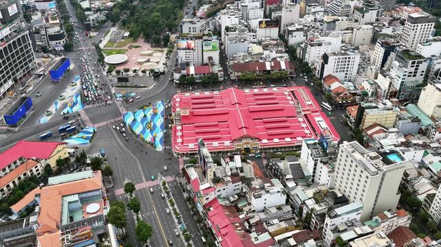 view aerial of Ben Thanh market in Ho Chi Minh City with development buildings, transportation, energy power infrastructure.