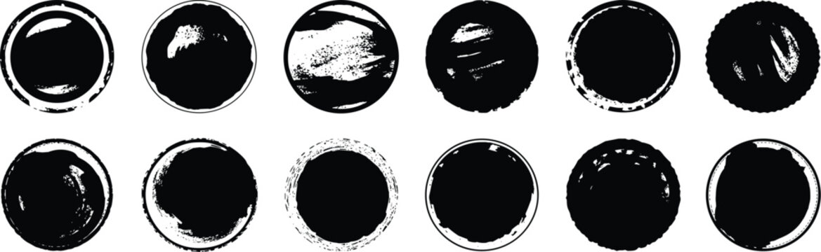 Set of twelve circular black rubber stamp impressions with distressed textures and varying grunge patterns arranged in two rows on a white background