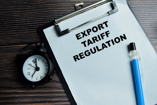 Concept of export tariff regulation write on clipboard isolated on Wooden Table. For trade policy deadlines and global commerce