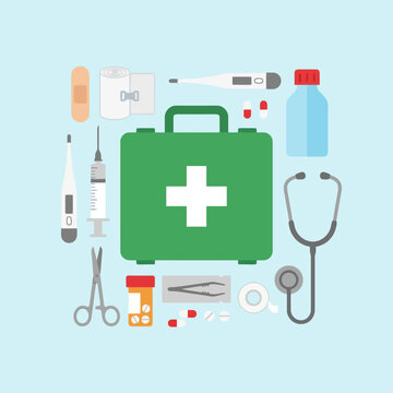 Medical supplies and equipment arranged on a light blue background, flat lay