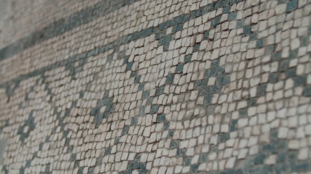 Macro shot of historic tesserae mosaic pattern with shallow depth of field