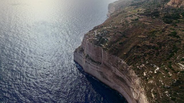 The Dingli Cliffs form a massive natural wall along Malta's isolated western coast, representing the highest point of the Maltese islands at over 250 meters above sea level.