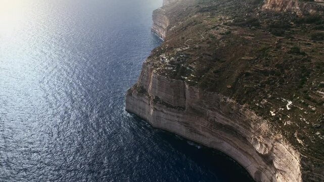 The Dingli Cliffs form a massive natural wall along Malta's isolated western coast, representing the highest point of the Maltese islands at over 250 meters above sea level.