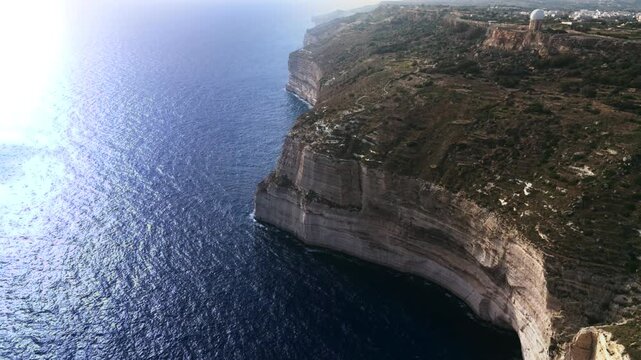 The Dingli Cliffs form a massive natural wall along Malta's isolated western coast, representing the highest point of the Maltese islands at over 250 meters above sea level.