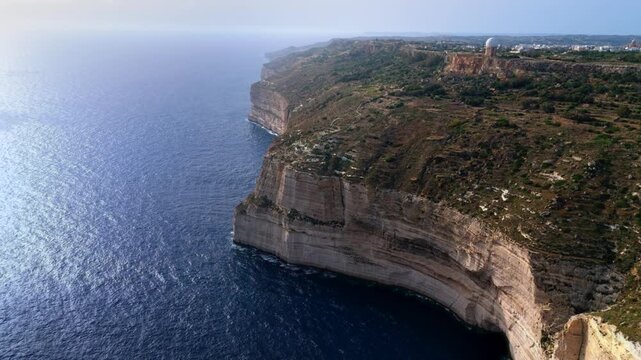 The Dingli Cliffs form a massive natural wall along Malta's isolated western coast, representing the highest point of the Maltese islands at over 250 meters above sea level.