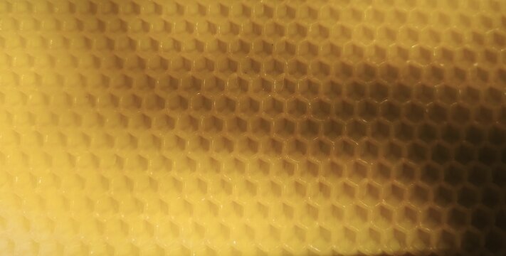 Yellow Honeycomb Texture Closeup with Soft Hexagon Pattern