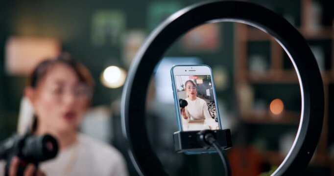 Woman, photographer and vlogger with phone screen or ring light for live recording in home. Female person, freelancer or content creator with smartphone display for online tutorial, advice or tips