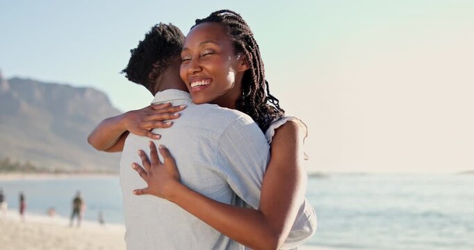 Happy, travel and couple at beach with hug, love and partner affection on tropical holiday. Smile, people and embrace at ocean with care, commitment and healthy relationship on getaway vacation