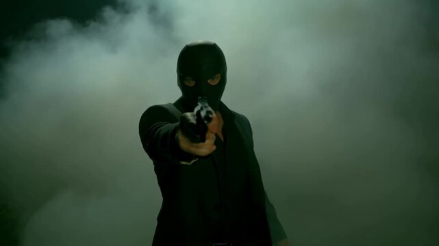 Suspenseful masked figure emerging from mist holding object in dramatic scene