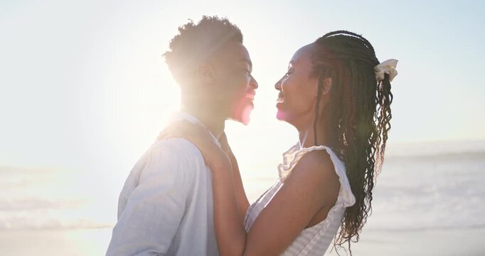 Smile, travel and couple at beach with love, affection and bonding on tropical holiday. Happy, admiration and black people at ocean with flare, commitment and healthy relationship on getaway vacation