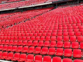 Rows of Red Plastic Stadium Seats in Sports Arena, Empty Football and Soccer Stadium Seating