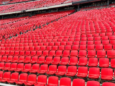 Rows of Red Plastic Stadium Seats in Sports Arena, Empty Football and Soccer Stadium Seating
