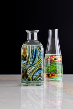 abstract reflection of colorful object inside a glass bottle with water, still life
