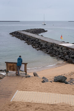 Man gazing at the sea in the bay of Saint-Jean-de-Luz. French Basque Country