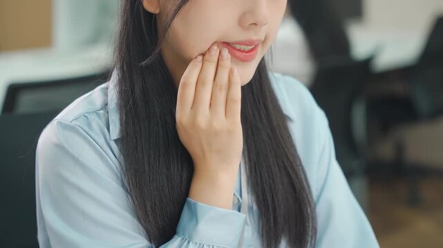 Businesswoman office worker female does desk work have mouth pain suffers from dry lips, mouth ulcers, cavities, toothaches, mouth ulcer sore, aphthous stomatitis, oral lesions, gingivitis periodontal